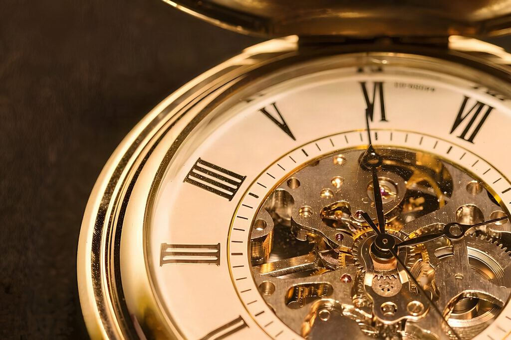 Close up of vintage pocket watch signifying time in minutes concept.